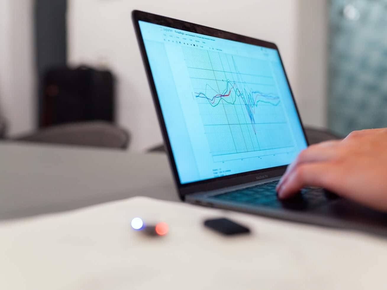 Laptop with graphs. Image source: https://unsplash.com/photos/f4pUuCc3M0g