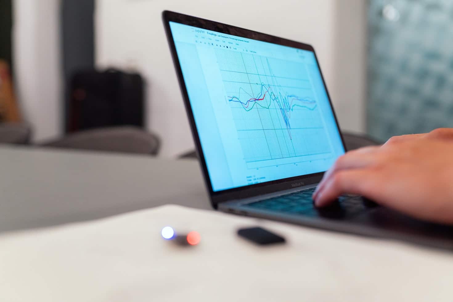 Laptop with graphs. Image source: https://unsplash.com/photos/f4pUuCc3M0g