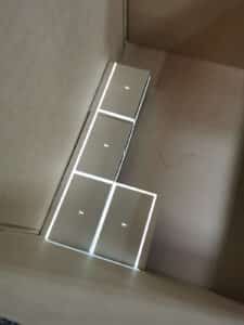 View inside a shipping crate with a light projection outlining the next object to be placed inside it.