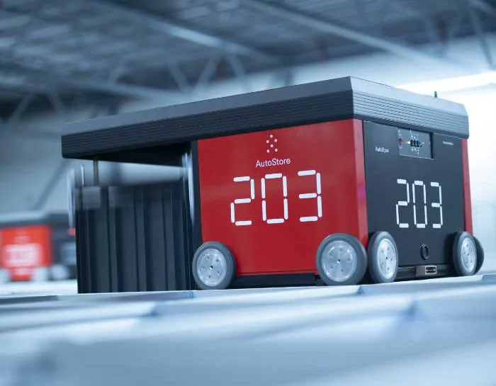 AutoStore-System - Selbstfahrender Roboter mit acht Rädern in einem Lager