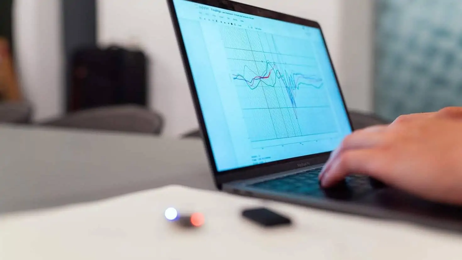 Laptop with graphs. Image source: https://unsplash.com/photos/f4pUuCc3M0g